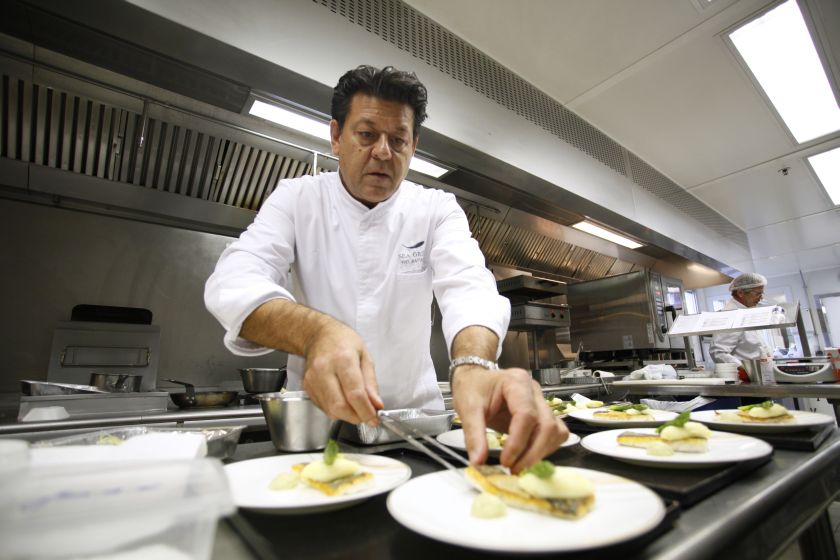 Belgian double starred chef, Yves Mattagne, prepares meals that will be served during Jet Airways business class flights, on December 5, 2014, in his kitchen at the Roissy-Charles de Gaulle airport in Roissy-en-France, outside Paris. — AFP pic