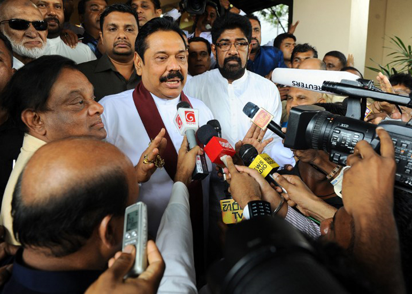 Sri Lankan President Mahinda Rajapakse speaks to journalists after handing over his nomination papers to the Election Commissioner, Colombo, December 23, 2014. u00e2u20acu201d AFP pic