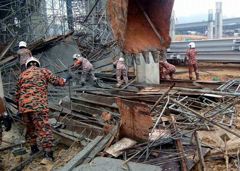 Firemen attempt to locate trapped workers after the collapse at Putra Heights MRT station, December 24, 2014. u00e2u20acu201d Fire and Rescue Department pic