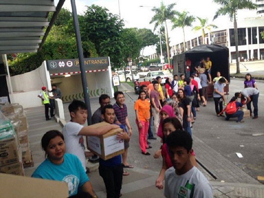 Volunteers from the Free Market’s flood relief initiative load supplies that will be sent to Kota Bharu, Kelantan, December 28, 2014. — Picture courtesy of Syed Azmi Alhabshi
