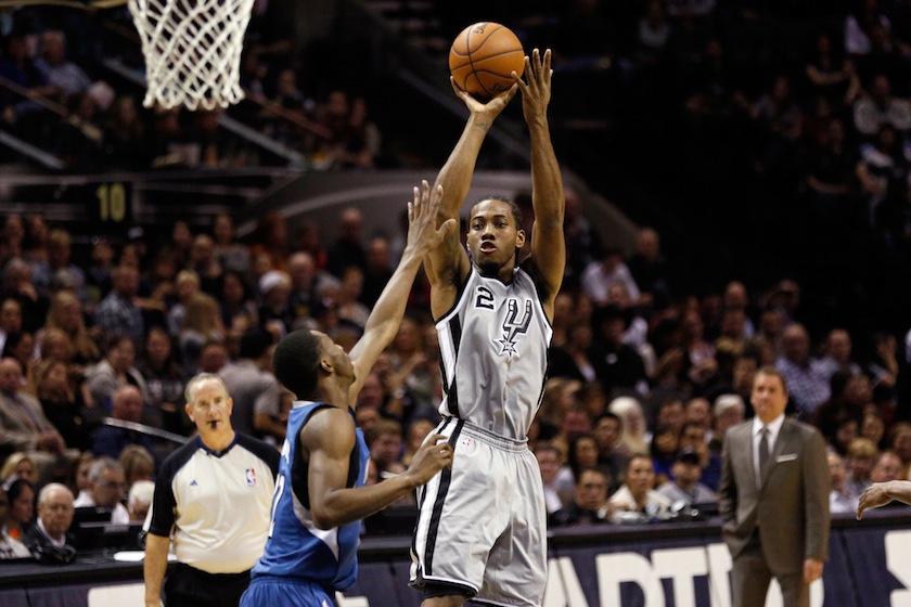 San Antonio Spurs small forward Kawhi Leonard (2) shoots the ball over Minnesota Timberwolves small forward Andrew Wiggins (front) during the first half at AT&T Center. u00e2u20acu201d Reuters pic