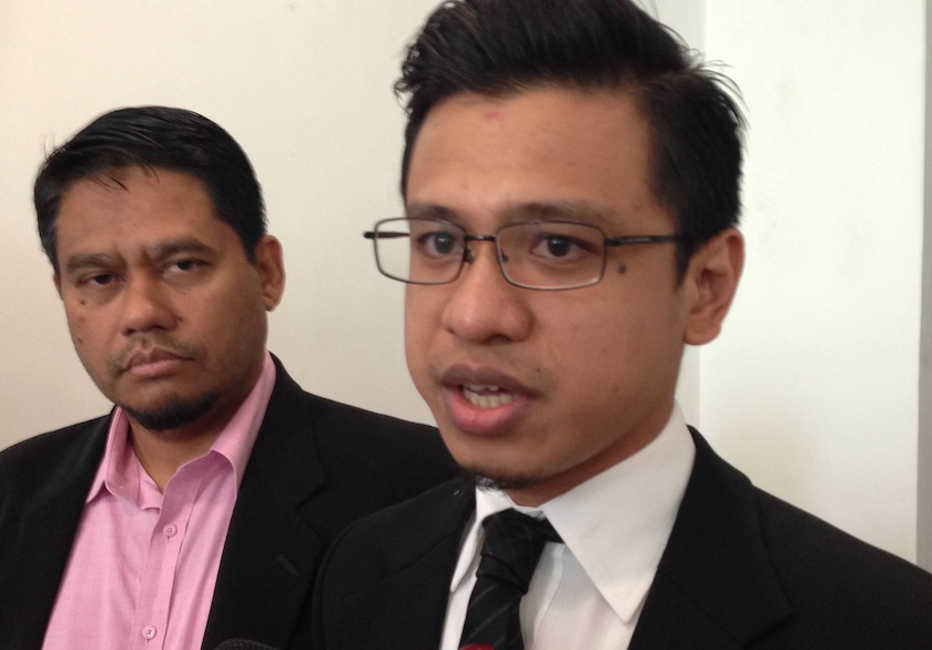Isma president Abdullah Zaik Abd Rahman (left) and lawyer Zainal Narudin speaks to reporters outside the Kajang Sessions Court, December 22, 2014. u00e2u20acu201d Picture by Melissa Chi