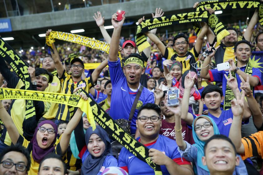 Malaysian fans cheer on as Harimau Malaya face Vietnam in the AFF Suzuki Cup 2014 semi-final first leg match at the Shah Alam Stadium, December 7, 2014. u00e2u20acu201d Picture by Choo Choy May