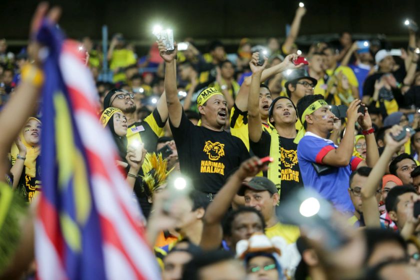Malaysian fans cheer on as Harimau Malaya face Vietnam in the AFF Suzuki Cup 2014 semi-final first leg match at the Shah Alam Stadium, December 7, 2014. u00e2u20acu201d Picture by Choo Choy May