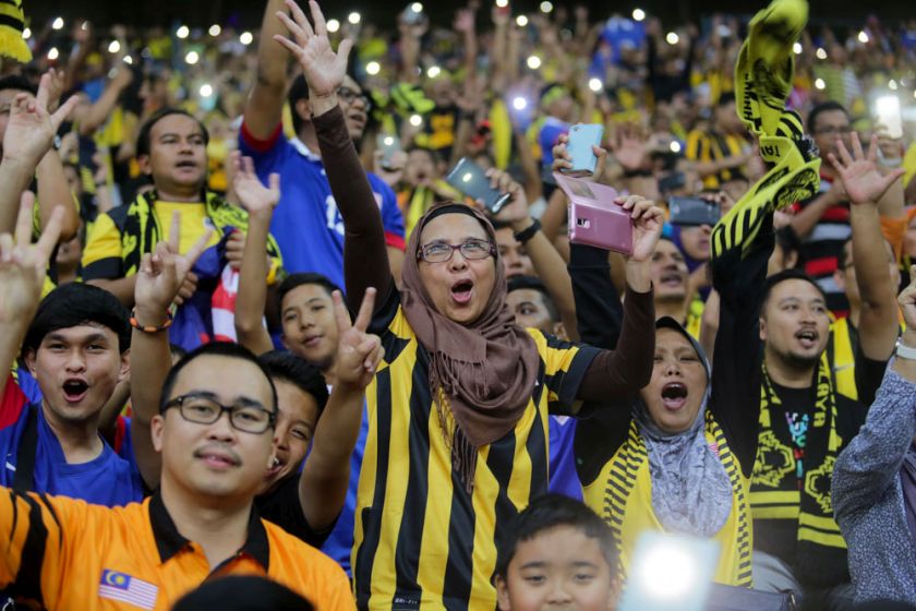Fans cheer on as Malaysia face Vietnam in the AFF Suzuki Cup 2014 semi-final first leg match at the Shah Alam Stadium, December 7, 2014. u00e2u20acu201d Picture by Choo Choy May