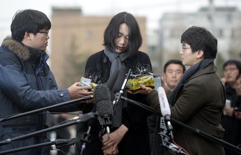 Cho Hyun-ah, also known as Heather Cho, daughter of Korean Air Lines chairman, Cho Yang-ho, appears in front of the media outside the offices of the Aviation and Railway Accident Investigation Board of the Ministry of Land, Infrastructure, Transport, in S