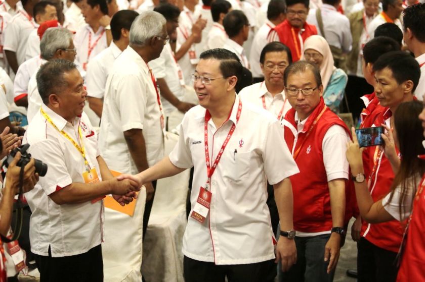 Lim Guan Eng greets an attendee at the DAP National Conference 2014, One City Mall, USJ, December 14, 2014. u00e2u20acu201d Picture by Choo Choy May
