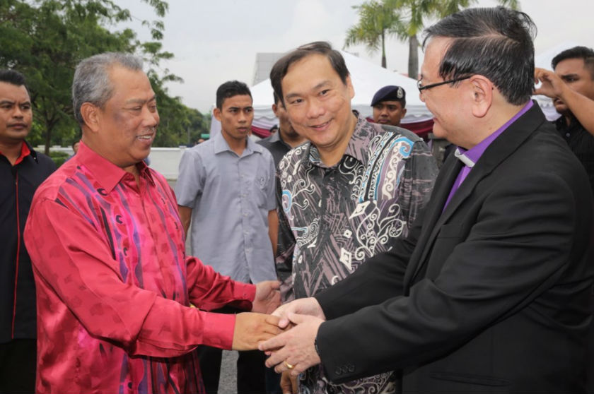 Rev Dr Eu Hong Seng is pictured (centre) as Bishop Dr Ong Hwai Teik greets Tan Sri Muhyiddin during his arrival at the Christian Federation of Malaysia Christmas Hi-Tea at Full Gospel Tabernacle, Subang Jaya, December 25, 2014. u00e2u20acu201d Picture by Choo Choy Ma