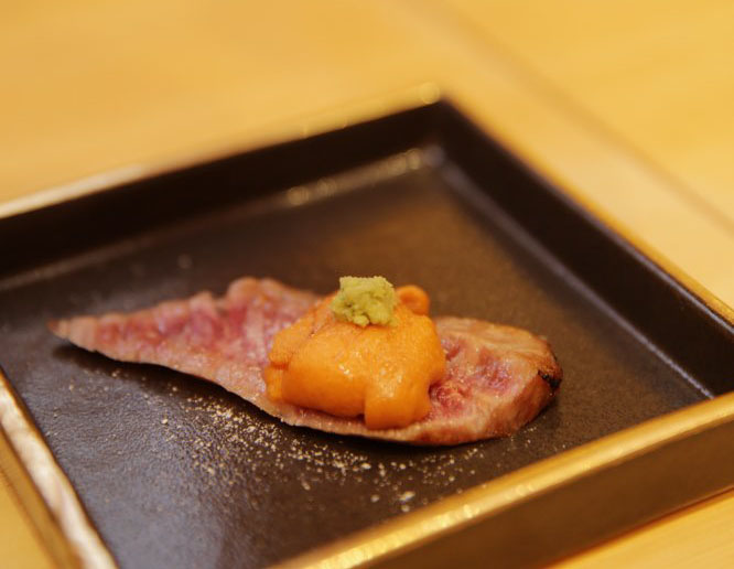 Seared Kobe beef roll topped with uni that just melts in your mouth. 