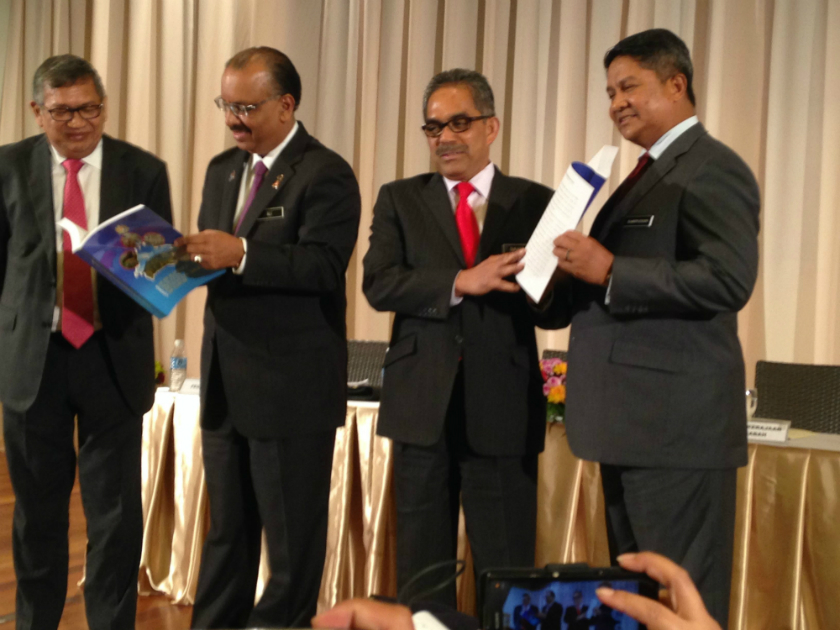 Chief Secretary to the Government Tan Sri Ali Hamsa (second left) with Attorney-General Tan Sri Abdul Gani Patail (left) are pictured during the release of the RCI report, December 3, 2014, in Kota Kinabalu. u00e2u20acu201d Picture by Julia Chan