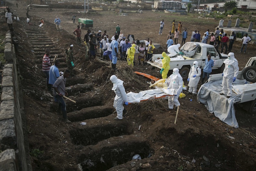 Health workers carry the body of an Ebola victim for burial at a cemetery in Freetown December 17, 2014. u00e2u20acu201d Reuters pic
