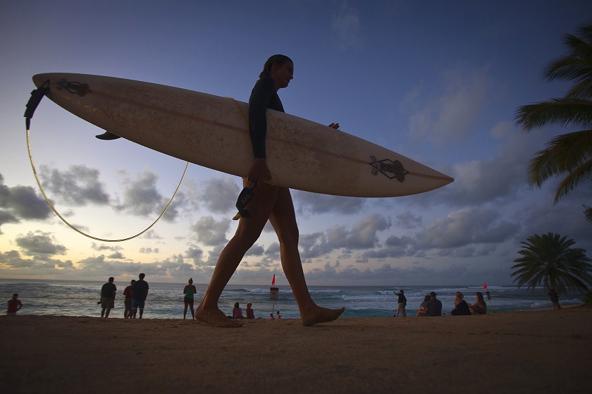 A female surfer walks out of the Pacific Ocean after spending time surfing the North Shore of Oahu in Pupukea, Hawaii December 13, 2014. u00e2u20acu201d Reuters pic