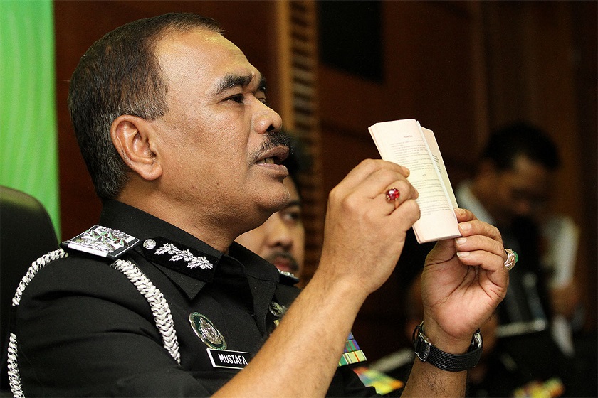 Director General of Immigration Malaysia, Datuk Mustfa Ibrahim show the Malaysian Passport to the media during press conference at the Jabatanu00c2u00a0Immigrationu00c2u00a0Malaysia in Putrajaya, December 8, 2014. u00e2u20acu201d Picture by Yusof Mat Isa 