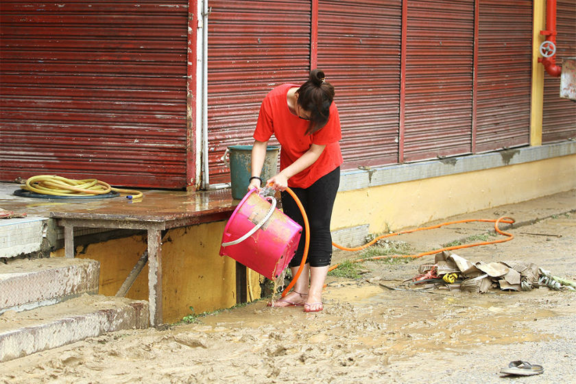 Shopkeepers in Kota Baru are busy cleaning up their business premises after the floods have receded in Kelantan, December 30, 2014. u00e2u20acu201d Picture by Yusof Mat Isa