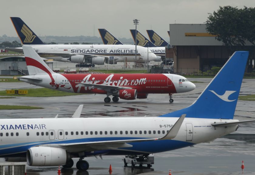 AirAsia's QZ8501 from Surabaya to Singapore, taking the same code as the missing plane which took off 24 hours earlier, taxis at Changi Airport in Singapore December 29, 2014. u00e2u20acu2022 Reuters pic