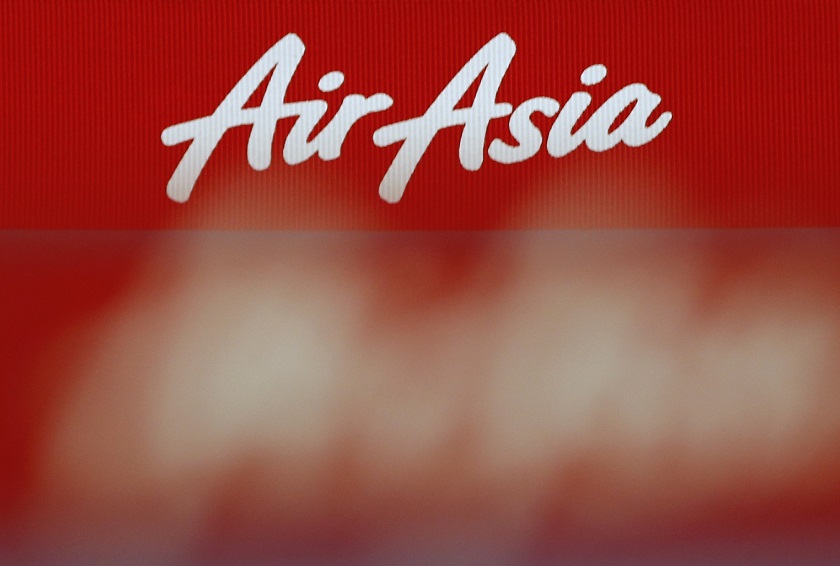 An AirAsia logo is pictured at the ticketing counter at Changi Airport in Singapore, December 29, 2014. u00e2u20acu201d Reuters pic
