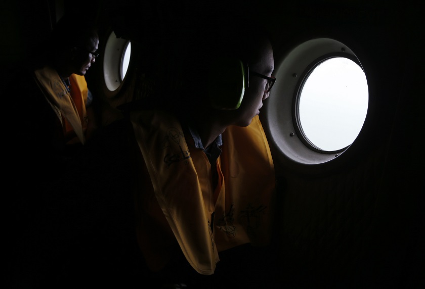 Republic of Singapore Air Force personnel survey the waters during a search and locate operation for the missing AirAsia flight QZ8501 plane at an undisclosed search area December 30, 2014. u00e2u20acu201d Reuters pic