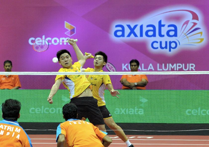 National doubles Tan Boon Heong (right) and Tan Wee Kiong beat Manu Atti and Sumeeth Reddy of India at the third placing playoff of the Axiata Cup Badminton championships 2014 at Stadium Badminton Kuala Lumpur in Cheras December 7, 2014, 21-11, 21-13. u00e2u20acu201d