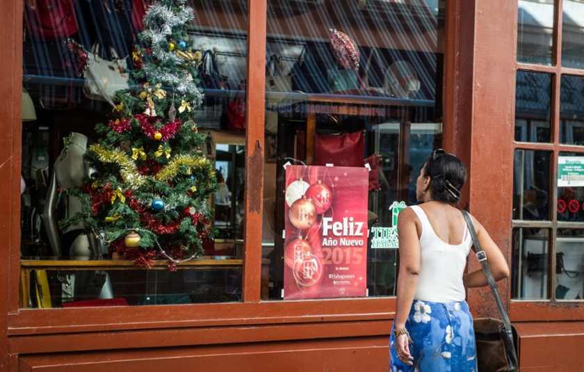 A Christmas tree adorns a window shop in Havana, on December 23, 2014. u00e2u20acu201d AFP pic