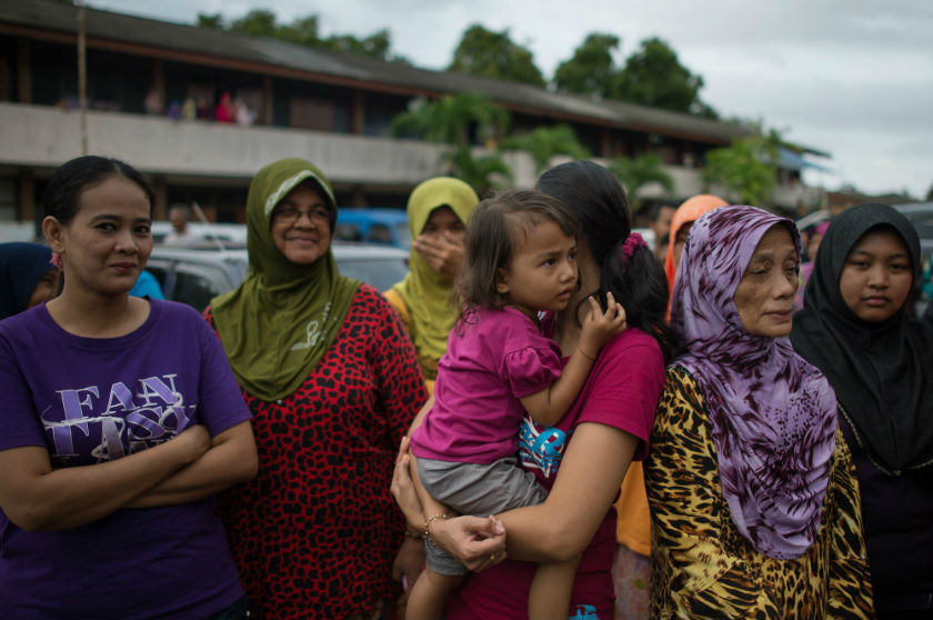 Flood victims who abandoned their homes to seek shelter gather at a school used as an evacuation centre in Pengkalan Chepa, near Kota Baru, December 28, 2014. u00e2u20acu201d AFP pic