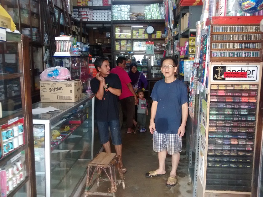Sundry shop owner Tan says he and his wife will do anything to start cleaning up in order to resume operating as quickly as possible at their shop in Jalan Temenggong, December 30, 2014. — Picture by Syed Jaymal Zahiid