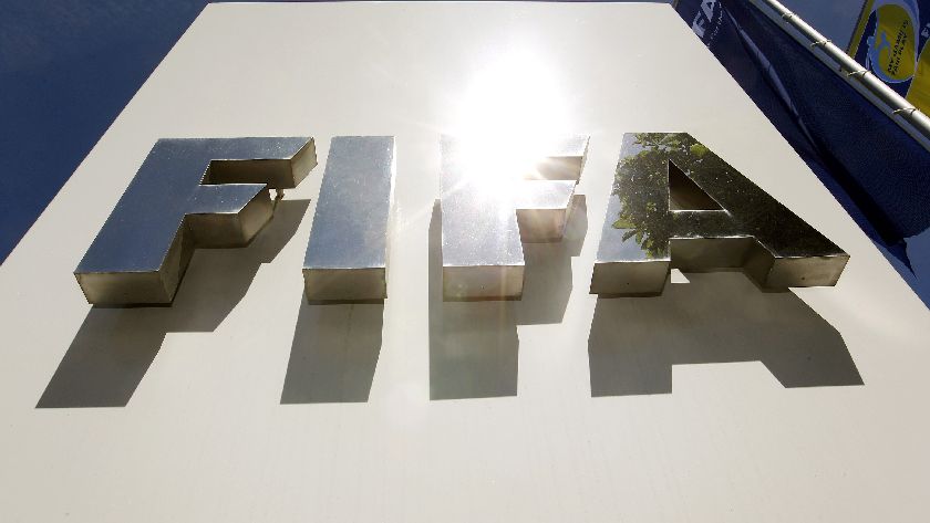 The sun is reflected on the FIFA logo in front of the FIFA headquarters in Zurich in this May 29, 2011, file photo.  REUTERS/Arnd Wiegmann