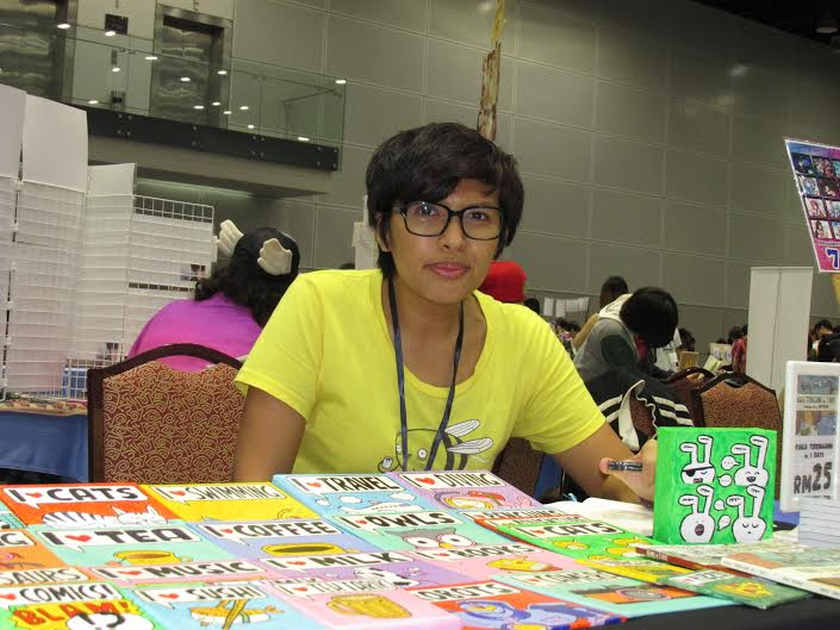 Mimi Mashud promoting her books at the Comic Fiesta 2014 which ends December 28, 2014. u00e2u20acu201d Picture by Tung Eng Swee