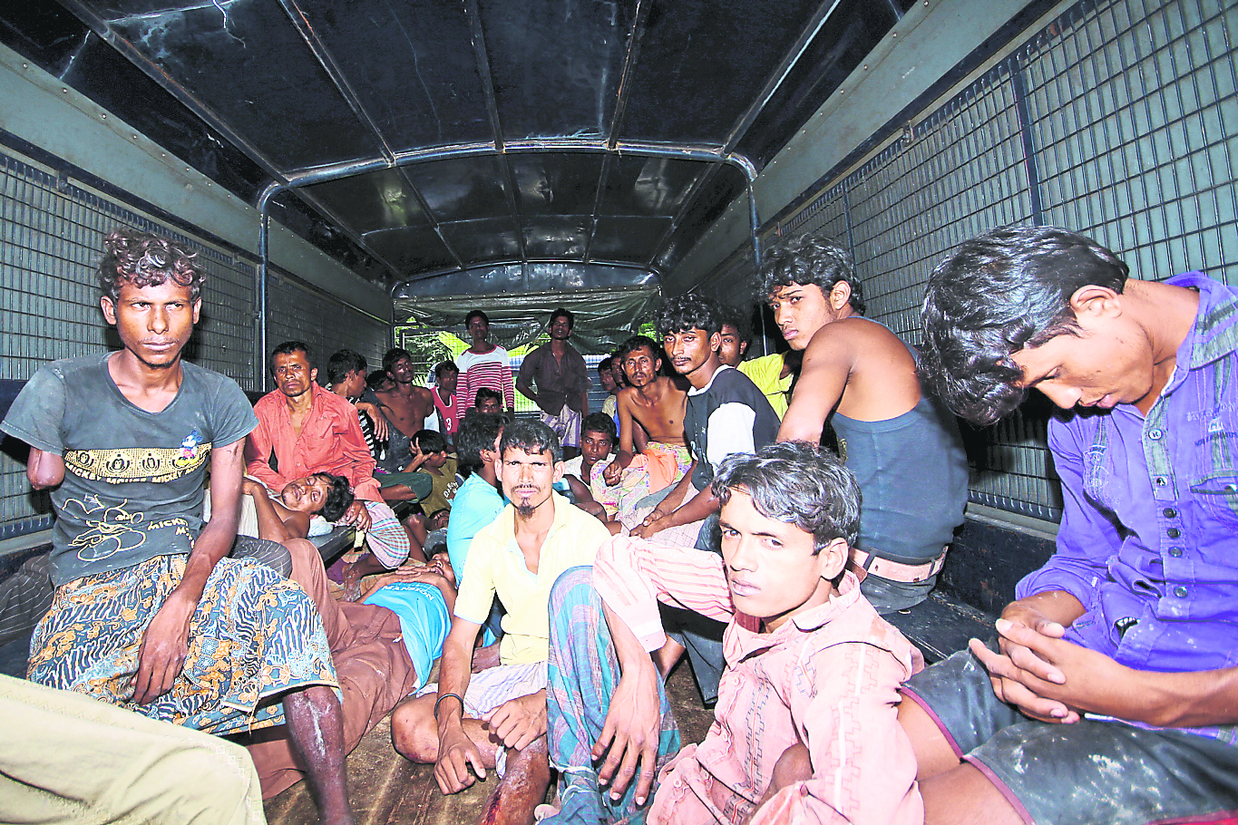 Some of the 90 illegal immigrants from Myanmar detained while attempting to enter the country near Bukit Batu Putih. u00e2u20acu201d Bernama pic