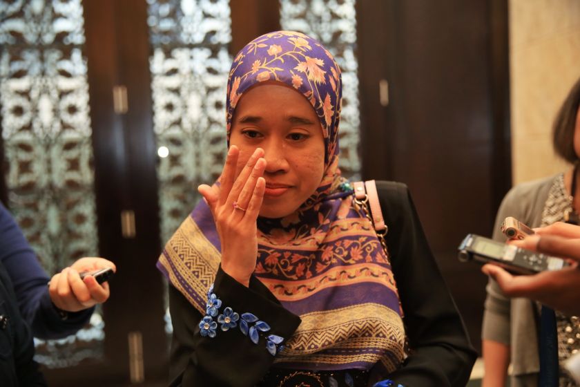 An emotional Nik Raina Nik Abdul Aziz speaks to members of the media after the Court of Appeal ruled in her favour, dismissing JAWIu00e2u20acu2122s contest against a High Court ruling. u00e2u20acu201d Picture by Saw Siow Feng