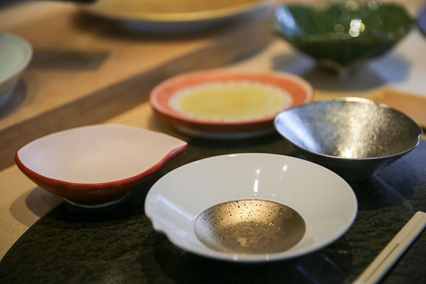 Beautiful ceramic bowls and plates also play a special part in a meal here.