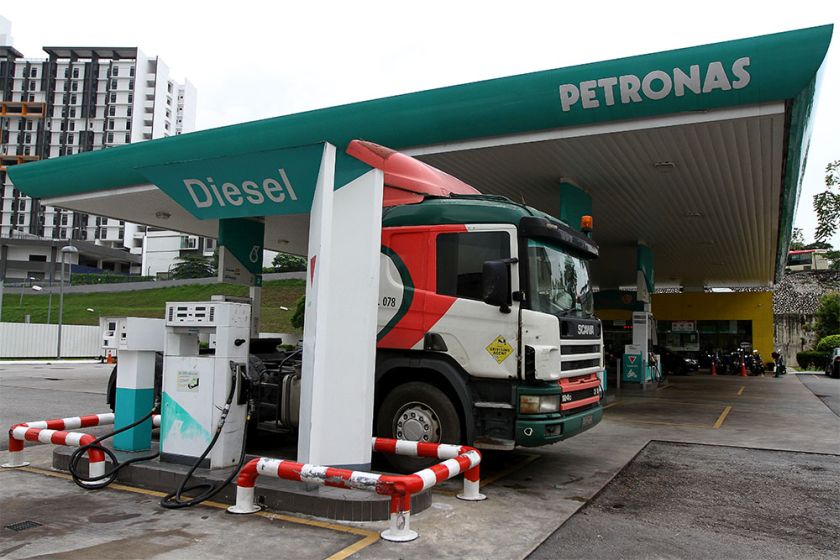 A trailer truck refuels at a Petronas service station, December 1, 2014. u00e2u20acu201d Picture by Yusof Mat Isa