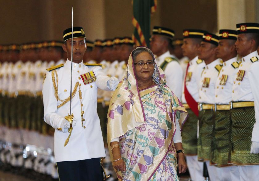 Bangladesh Prime Minister Sheikh Hasina inspects the guard of honour during a welcoming ceremony in Putrajaya December 3, 2014. u00e2u20acu201d Reuters pic