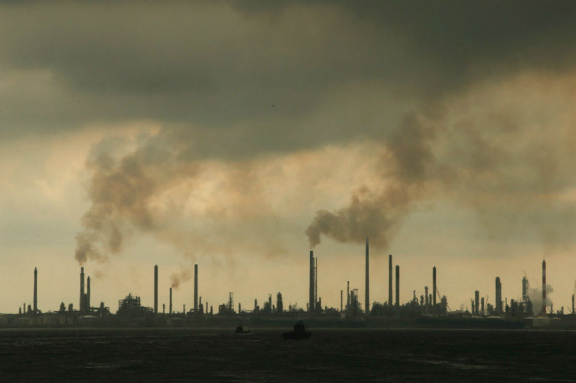 Storm clouds gather over Shellu00e2u20acu2122s Pulau Bukom oil refinery in Singapore December 17, 2014. u00e2u20acu201d Reuters pic