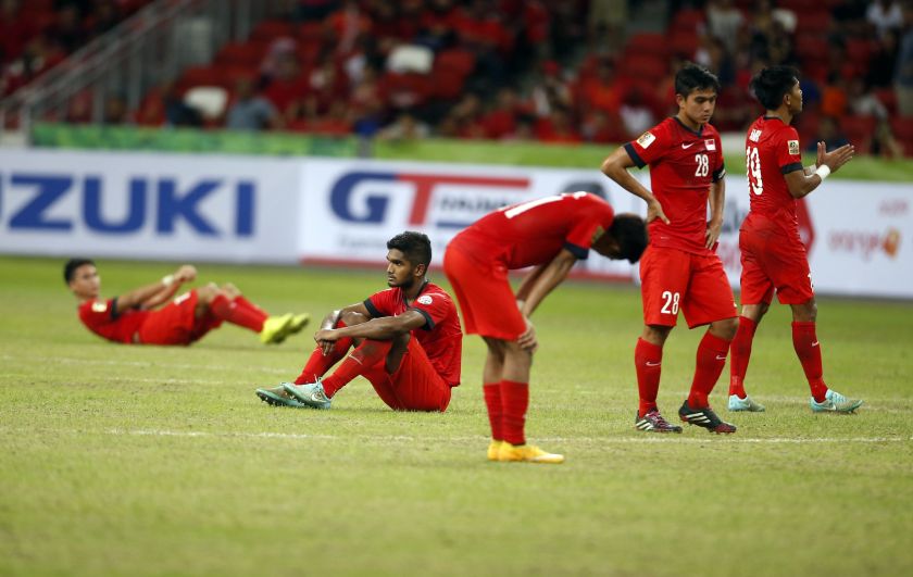 Singapore's players react after losing 3-1 to Malaysia in their Suzuki Cup Group B match at the National Stadium in Singapore November 29, 2014. u00e2u20acu201d Reuters pic