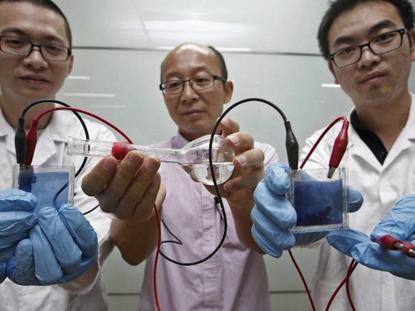 NTU's School of Electrical and Electronic Engineering research staff Zheng Ke (Left) ,Liu He (right) and Professor Sun Xiaowei pose with the self-tinting window on Dec 16, 2014. u00c2u00a0u00e2u20acu201du00c2u00a0Today pic