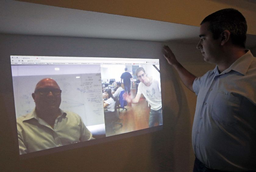 Temasys Communications chief technology officer Alexandre Gouaillard runs a demonstration of WebRTC in his office in Singapore October 28, 2014