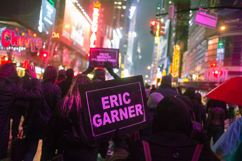 Protesters, demanding justice for Eric Garner, hold placards while marching through Times Square, New York December 5, 2014. u00e2u20acu201d Reuters pic