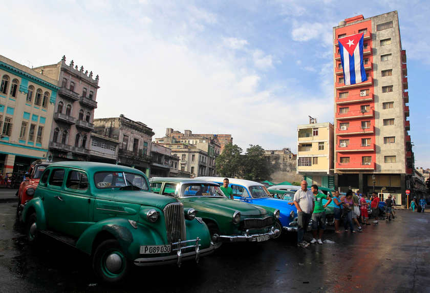 Vintage cars used as taxis are parked on a street in Havana December 27, 2014. u00e2u20acu201d Reuters pic