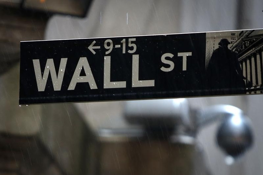 A Wall Street sign in the rain outside the New York Stock Exchange in New York June 9, 2014. u00e2u20acu201d Reuters pic