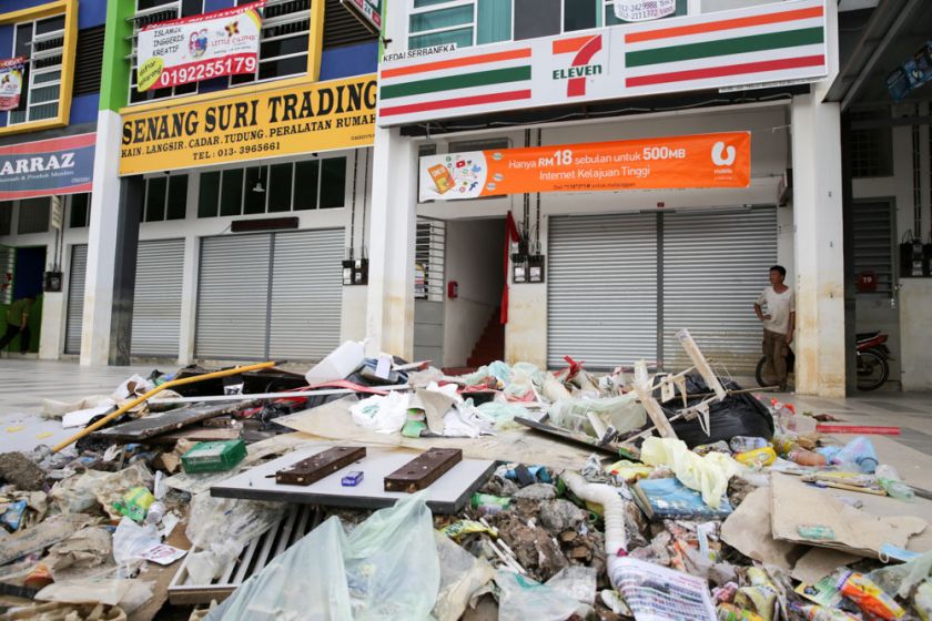 Damaged goods are dumped in an open area outside a store in Temerloh, January 13, 2015. ― Picture by Choo Choy May