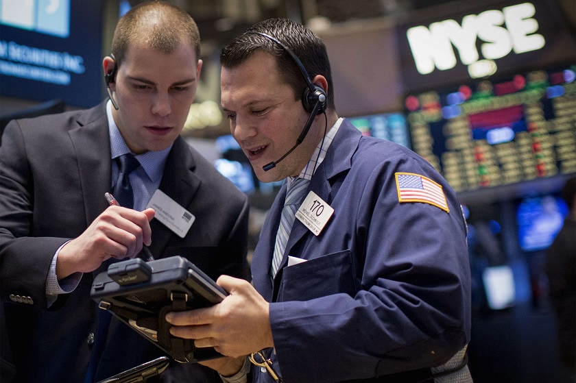 Traders work on the floor of the New York Stock Exchange in this picture released on January 15, 2015. — Reuters pic