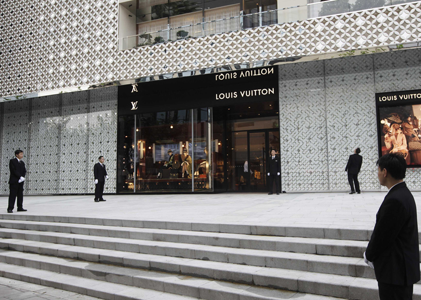 Security guards stand in front of the soon to be opened largest Louis Vuitton store in China in Shanghai July 18, 2012. u00e2u20acu201d Reuters pic