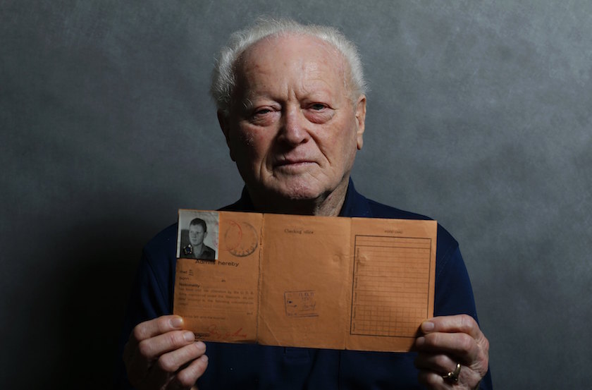 Auschwitz death camp survivor Janos Forgacs, 87, holds a document as he poses for a portrait in Budapest January 12, 2015. — Reuters pic