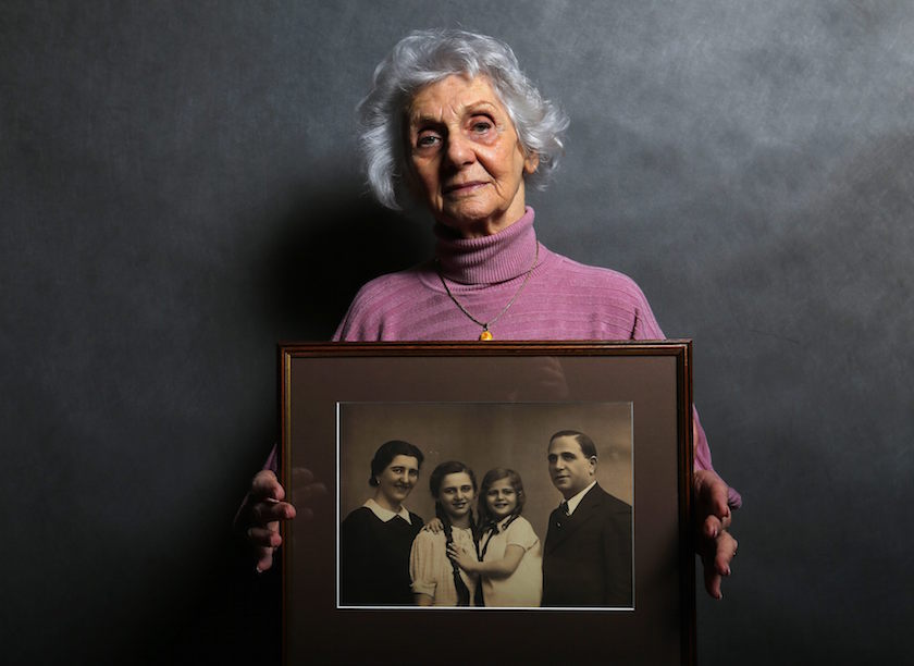 Auschwitz death camp survivor Eva Fahidi, 90, holds a picture of her family, who were all killed in the concentration camp during World War Two, as she poses for a portrait in Budapest January 12, 2015. — Reuters pic