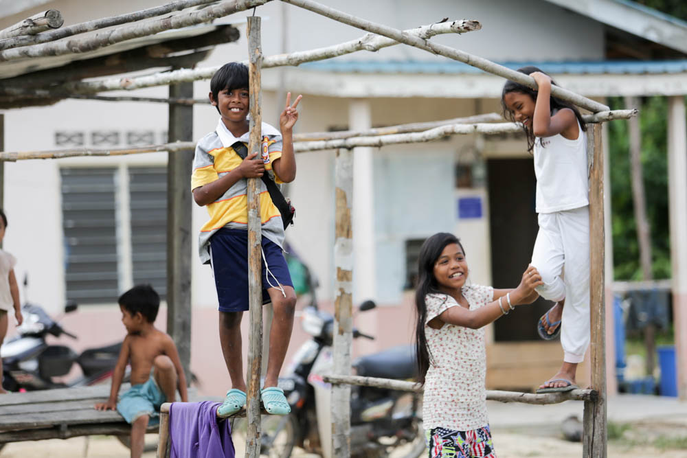 Children in Kampong Paya Besar playing with each other. — Pix by Choo Choy May