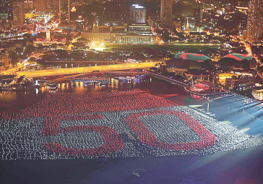 A floating installation of 25,000 wishing spheres line the Marina Bay in the backdrop of the city’s financial district ahead of the New Year’s Day countdown celebrations in Singapore. — Picture by Reuters