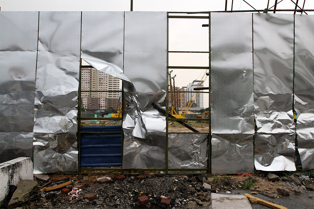 The damaged hoarding of the Datum Jelatek Project is seen following a demonstration by a group of residents in Taman Keramat, Kuala Lumpur, January 25, 2015. — Picture by Yusof Mat Isa