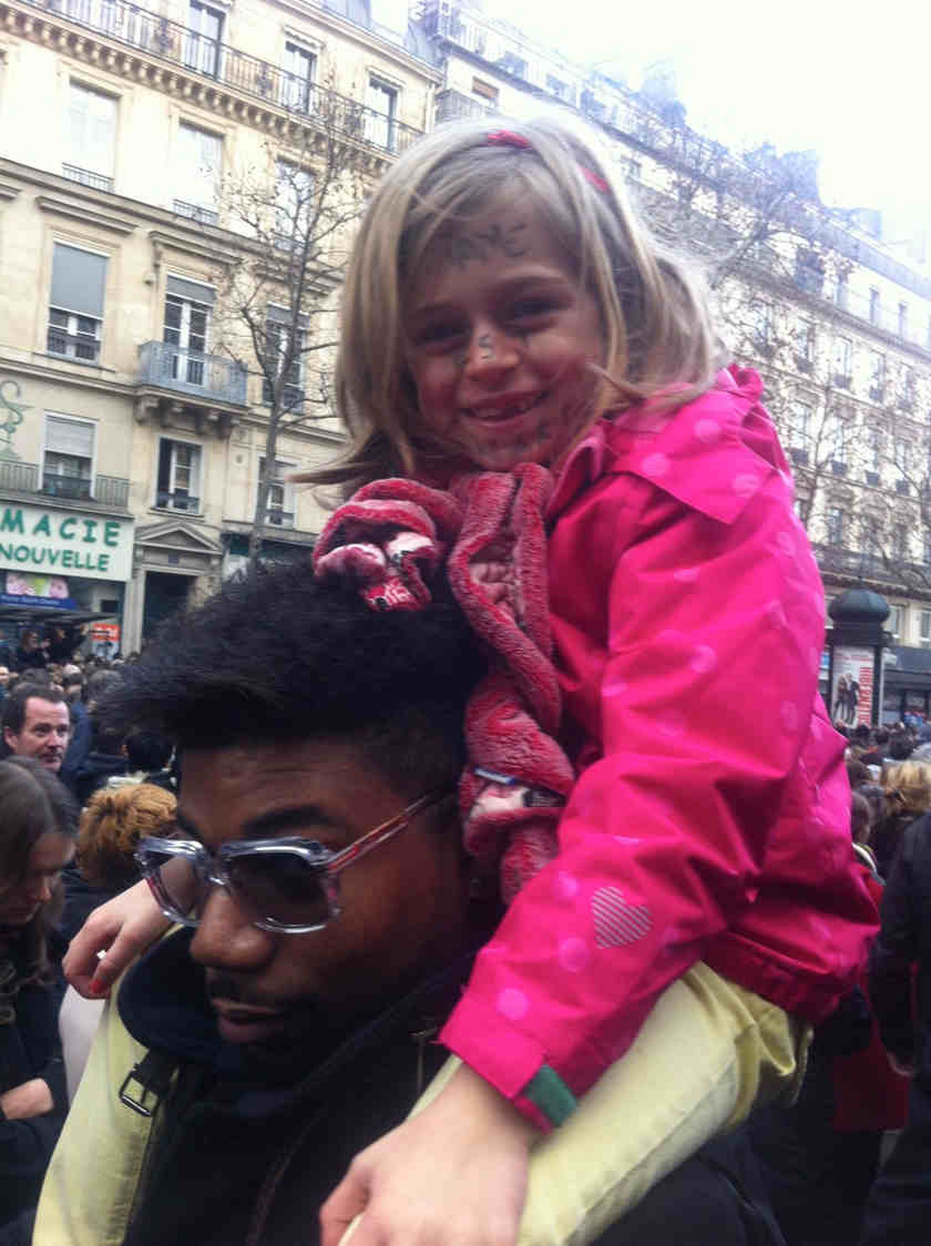 The six-year-old daughter of Parisian Gaelle Heyert with 'I am Charlie' written on her face.