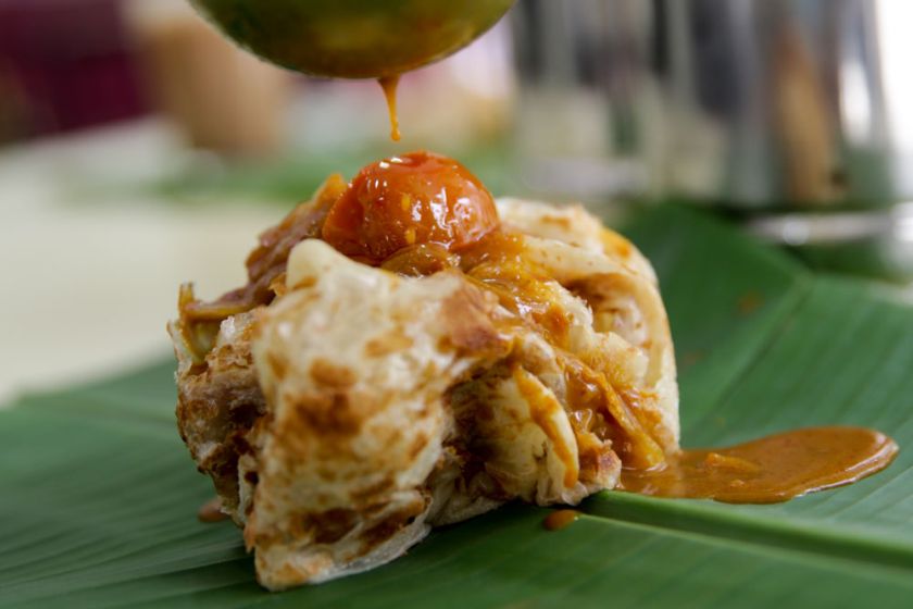 The iconic roti canai with its light texture and crispy bits is best eaten with dhal and curry.
