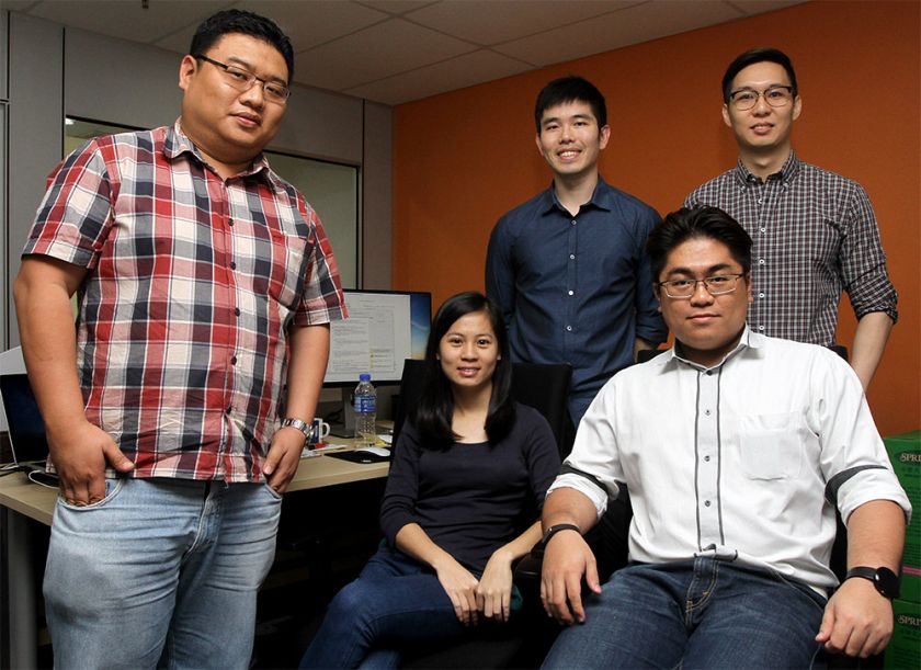 Snappymob co-founders Alvin Ting (left) and Allen Ding (third from the left) poses with the start-up staffs at their office. ― Picture by Yusof Mat Isa